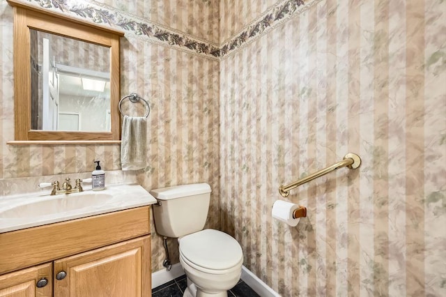 7488 Hydram Ave S, Cottage Grove, MN 55016 - half bathroom featuring toilet, vanity, and baseboards
