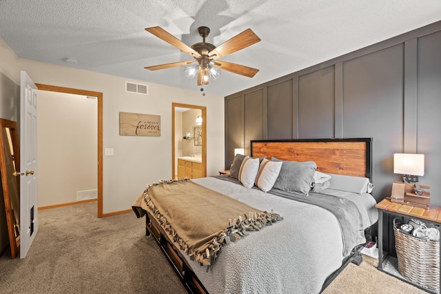 1324 Pembrooke Ln, Waconia, MN 55387 - bedroom with carpet, a ceiling fan, ensuite bath, and a textured ceiling