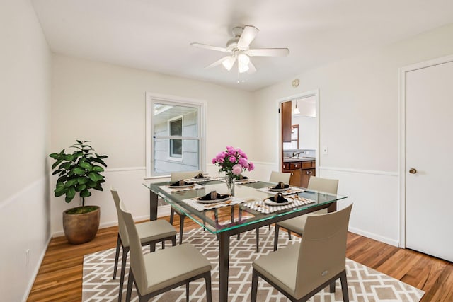 dining room featuring ceiling fan and light wood-style flooring