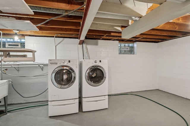 washroom featuring laundry area and washer and dryer
