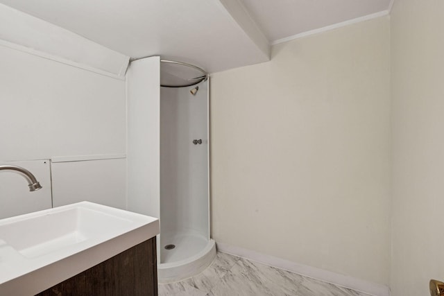 full bathroom featuring vanity, baseboards, marble finish floor, and a stall shower