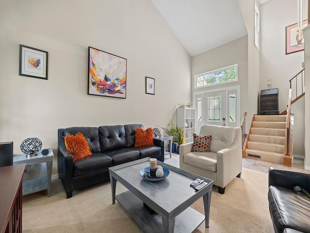 11004 Oregon Curv, Bloomington, MN 55438 - living room with high vaulted ceiling, light colored carpet, and stairway
