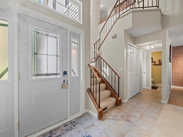 11004 Oregon Curv, Bloomington, MN 55438 - entrance foyer with stairs, a towering ceiling, and tile patterned floors