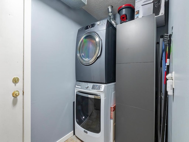 11004 Oregon Curv, Bloomington, MN 55438 - washroom with stacked washer / drying machine and a textured ceiling