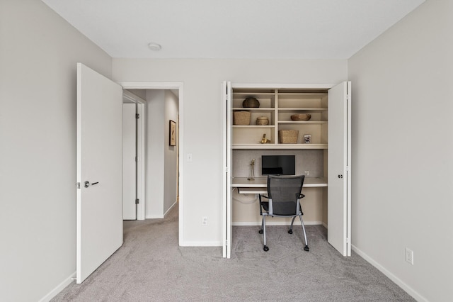 office space featuring baseboards and carpet floors