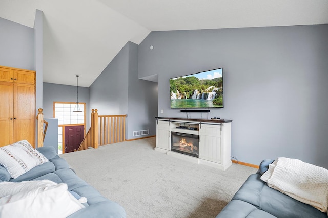 367 Garden Dr, Delano, MN 55328 - living area featuring light carpet and high vaulted ceiling