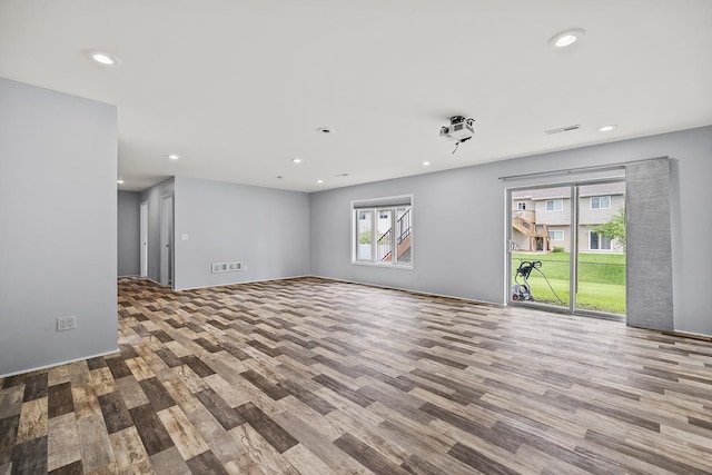 367 Garden Dr, Delano, MN 55328 - unfurnished living room with wood finished floors and recessed lighting