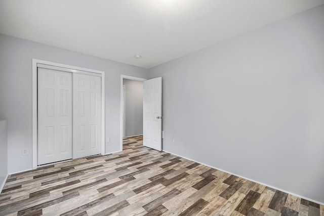 367 Garden Dr, Delano, MN 55328 - unfurnished bedroom featuring wood finished floors and a closet