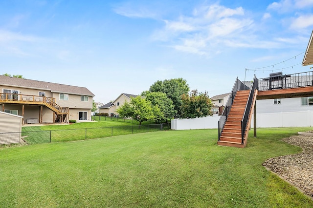 367 Garden Dr, Delano, MN 55328 - fenced backyard with stairway, a wooden deck, and a residential view