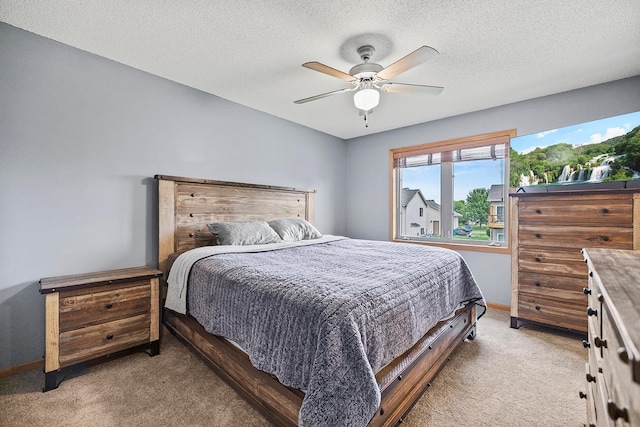367 Garden Dr, Delano, MN 55328 - bedroom with light carpet, a textured ceiling, and a ceiling fan