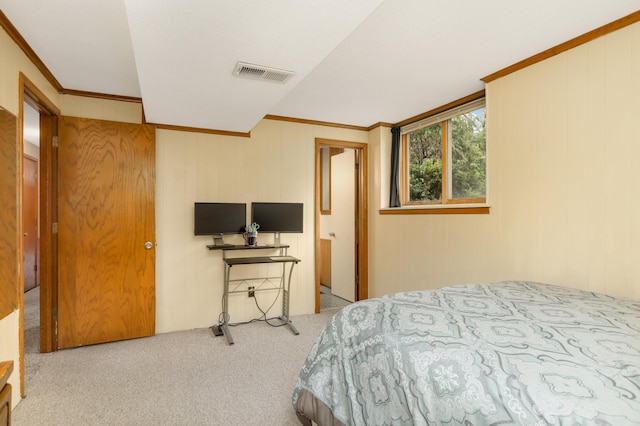 carpeted bedroom with crown molding and visible vents
