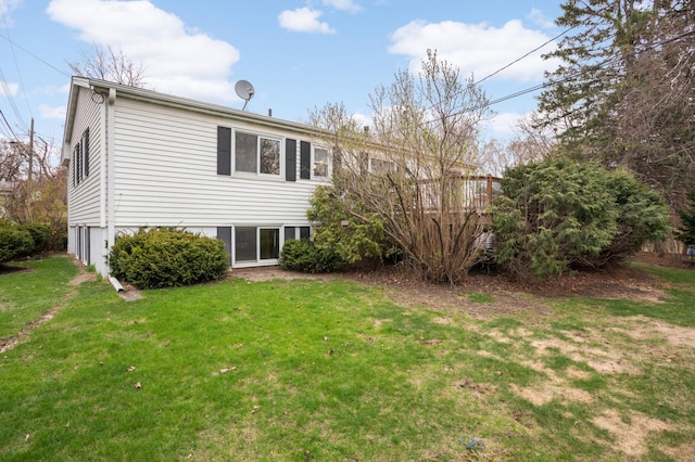 back of house with a yard