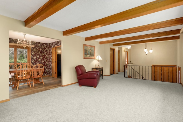 3308 Gate Rd, Saint Anthony, MN 55418 - sitting room featuring a chandelier, carpet, beamed ceiling, an upstairs landing, and baseboards