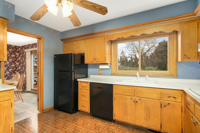 3308 Gate Rd, Saint Anthony, MN 55418 - kitchen featuring black appliances, wallpapered walls, brick patterned floors, a sink, and healthy amount of natural light