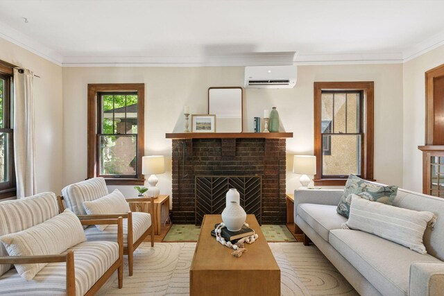 living area featuring a wall mounted AC, a fireplace, and ornamental molding