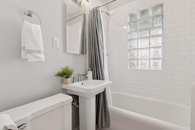 bathroom with toilet and shower / bath combination with curtain