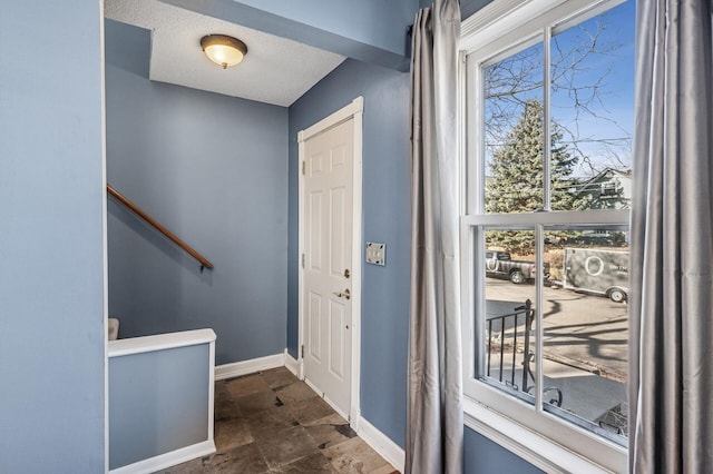 919 6th Ave S, Stillwater, MN 55082 - entryway with baseboards and dark stone finish flooring