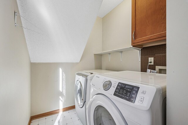 919 6th Ave S, Stillwater, MN 55082 - washroom with independent washer and dryer, cabinet space, light floors, and a textured ceiling