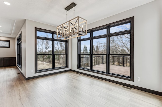 3731 Crestwood Rdg NE, Alexandria Twp, MN 56308 - unfurnished dining area with recessed lighting, an inviting chandelier, wood finished floors, visible vents, and baseboards