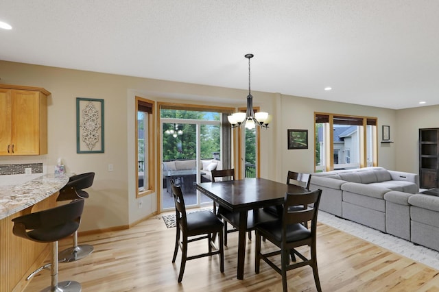 27130 Hickory Ridge Dr, Elko New Market, MN 55020 - dining space featuring a chandelier, light wood-type flooring, baseboards, and recessed lighting