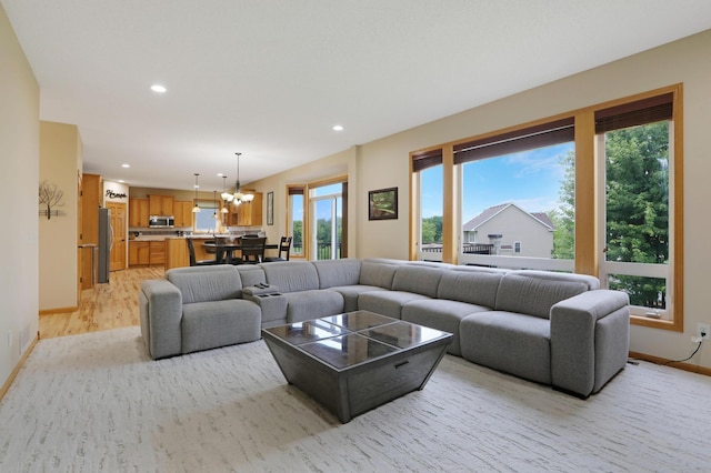 27130 Hickory Ridge Dr, Elko New Market, MN 55020 - living area featuring a chandelier, light wood-type flooring, baseboards, and recessed lighting