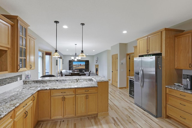 27130 Hickory Ridge Dr, Elko New Market, MN 55020 - kitchen with glass insert cabinets, a peninsula, recessed lighting, stainless steel refrigerator with ice dispenser, and open floor plan