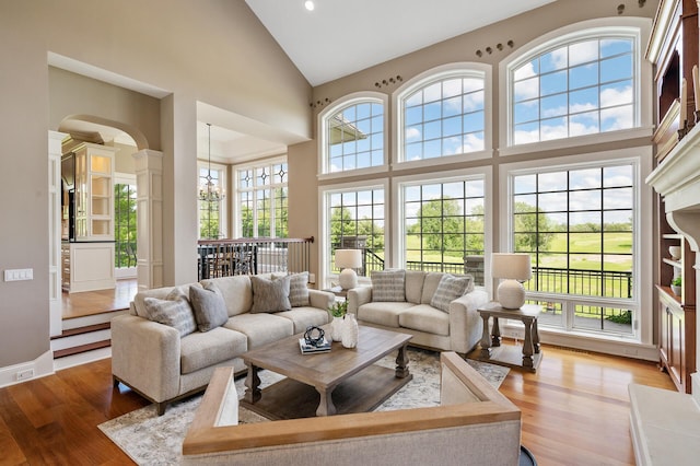 sunroom featuring arched walkways