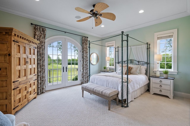 bedroom featuring light carpet, french doors, crown molding, and access to exterior