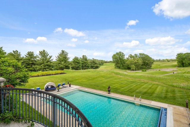 pool featuring view of golf course and a yard