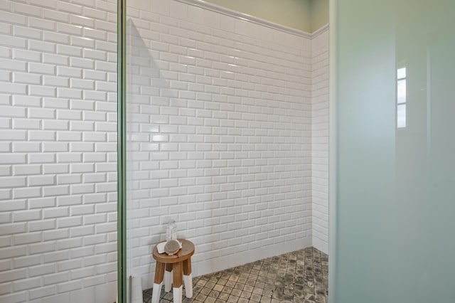 interior space featuring tiled shower