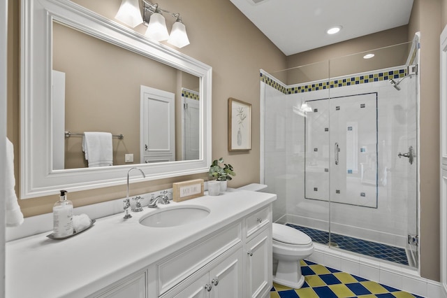 full bathroom featuring toilet, recessed lighting, a stall shower, and vanity