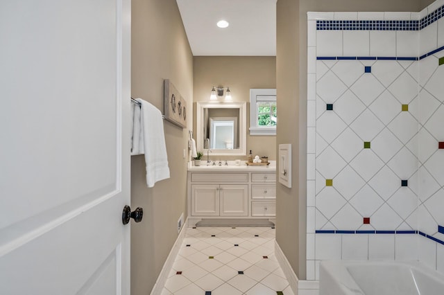 full bath with tile patterned floors, recessed lighting, vanity, and baseboards