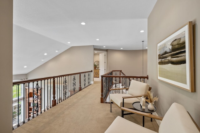 corridor featuring carpet floors, recessed lighting, and vaulted ceiling