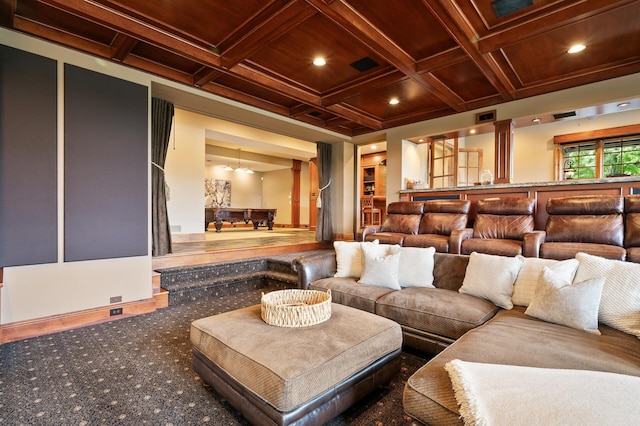 home theater room with carpet, visible vents, beamed ceiling, and coffered ceiling