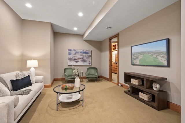 carpeted living area with baseboards, visible vents, and recessed lighting