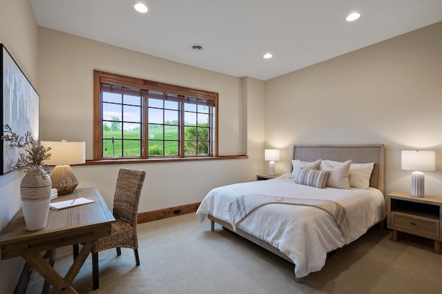 carpeted bedroom featuring visible vents, baseboards, and recessed lighting