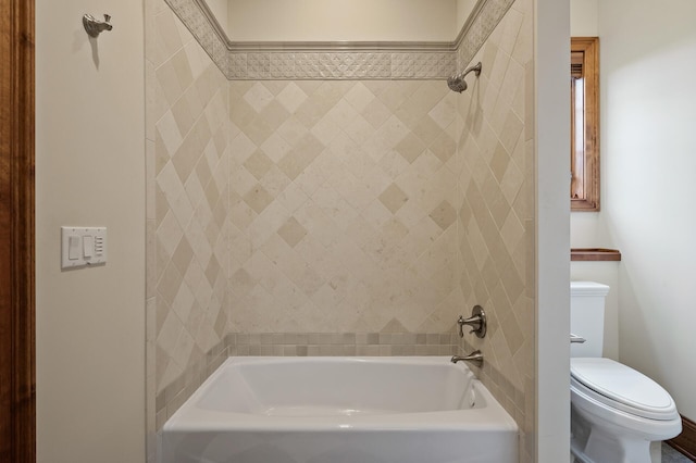 bathroom featuring  shower combination and toilet