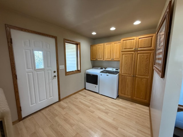 washroom with recessed lighting, light wood finished floors, washing machine and dryer, baseboards, and cabinet space
