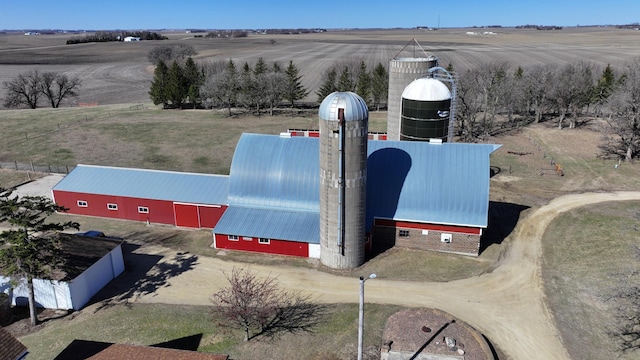 birds eye view of property with a rural view