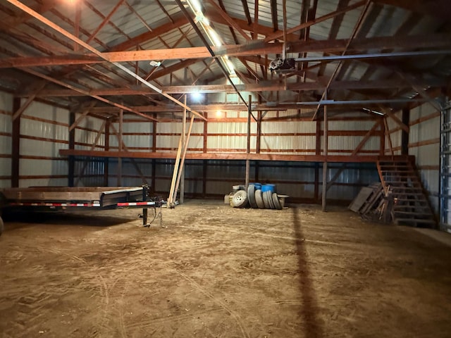 interior space with metal wall and a garage door opener