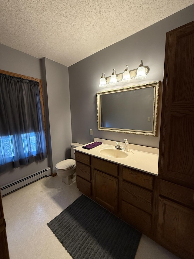 20343 680th Ave, Alden, MN 56009 - bathroom with baseboard heating, vanity, and a textured ceiling