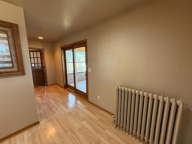 20343 680th Ave, Alden, MN 56009 - doorway with radiator and light wood-style flooring