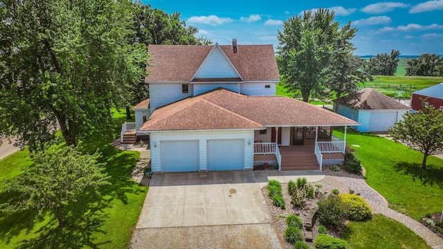 20343 680th Ave, Alden, MN 56009 - view of front of property featuring covered porch, concrete driveway, an attached garage, a front yard, and roof with shingles