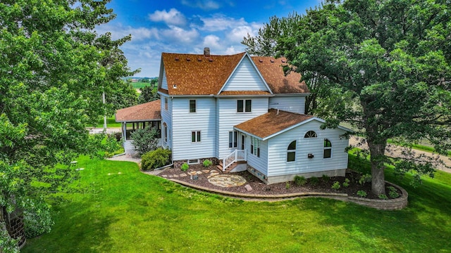 20343 680th Ave, Alden, MN 56009 - back of property with a yard, a shingled roof, and a chimney