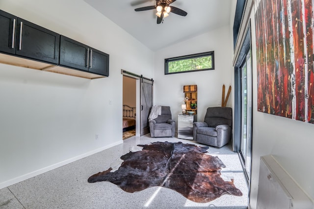 4681 Mission Rd NE, Sugar Bush Twp, MN 56601 - living area featuring a barn door, baseboards, a ceiling fan, high vaulted ceiling, and dark aggregate flooring