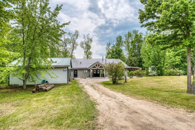 4681 Mission Rd NE, Sugar Bush Twp, MN 56601 - view of front of house featuring dirt driveway, a front lawn, and metal roof