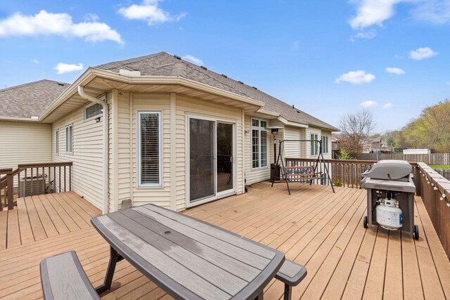 wooden terrace featuring fence and grilling area