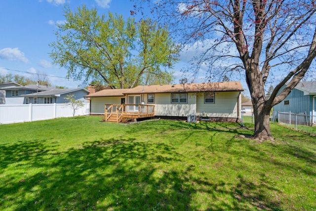 back of house with a deck
