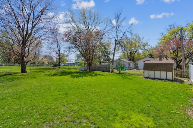 view of yard with a storage shed and an outdoor structure