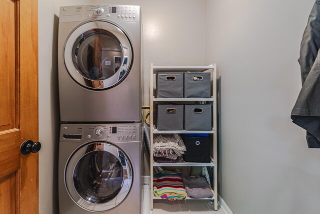 washroom with estacked washer and dryer